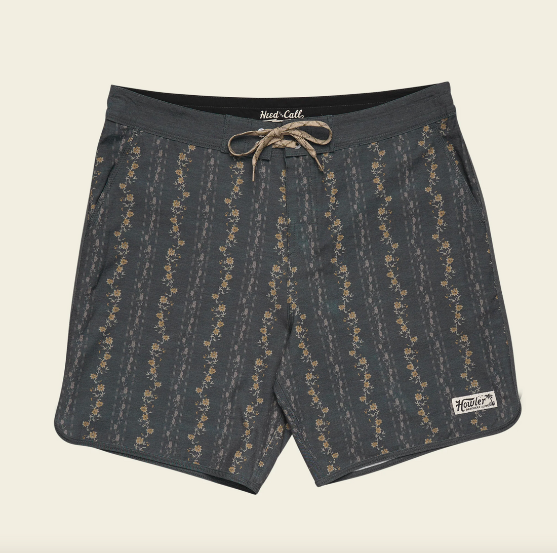 Dark gray shorts with a subtle pattern on a beige background
